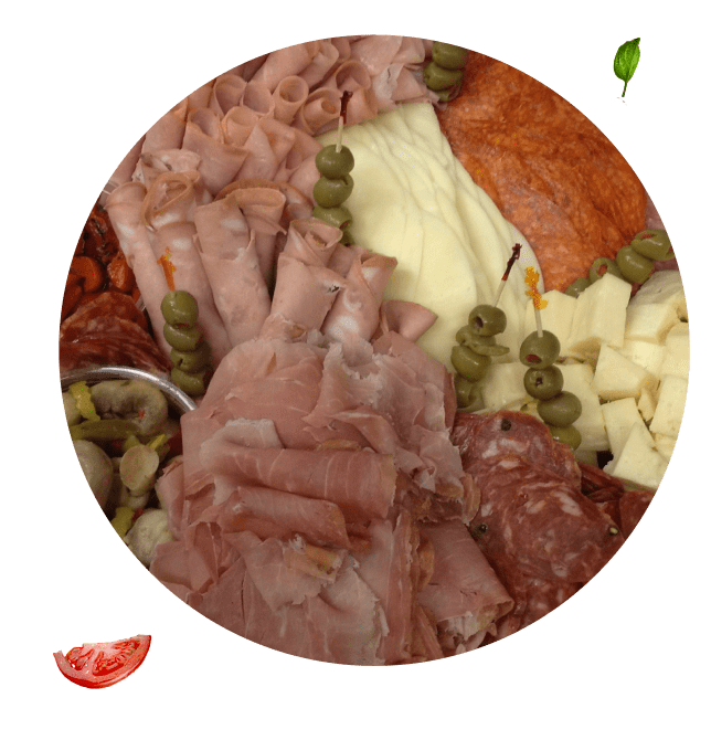 A round plate of food with meat and vegetables.