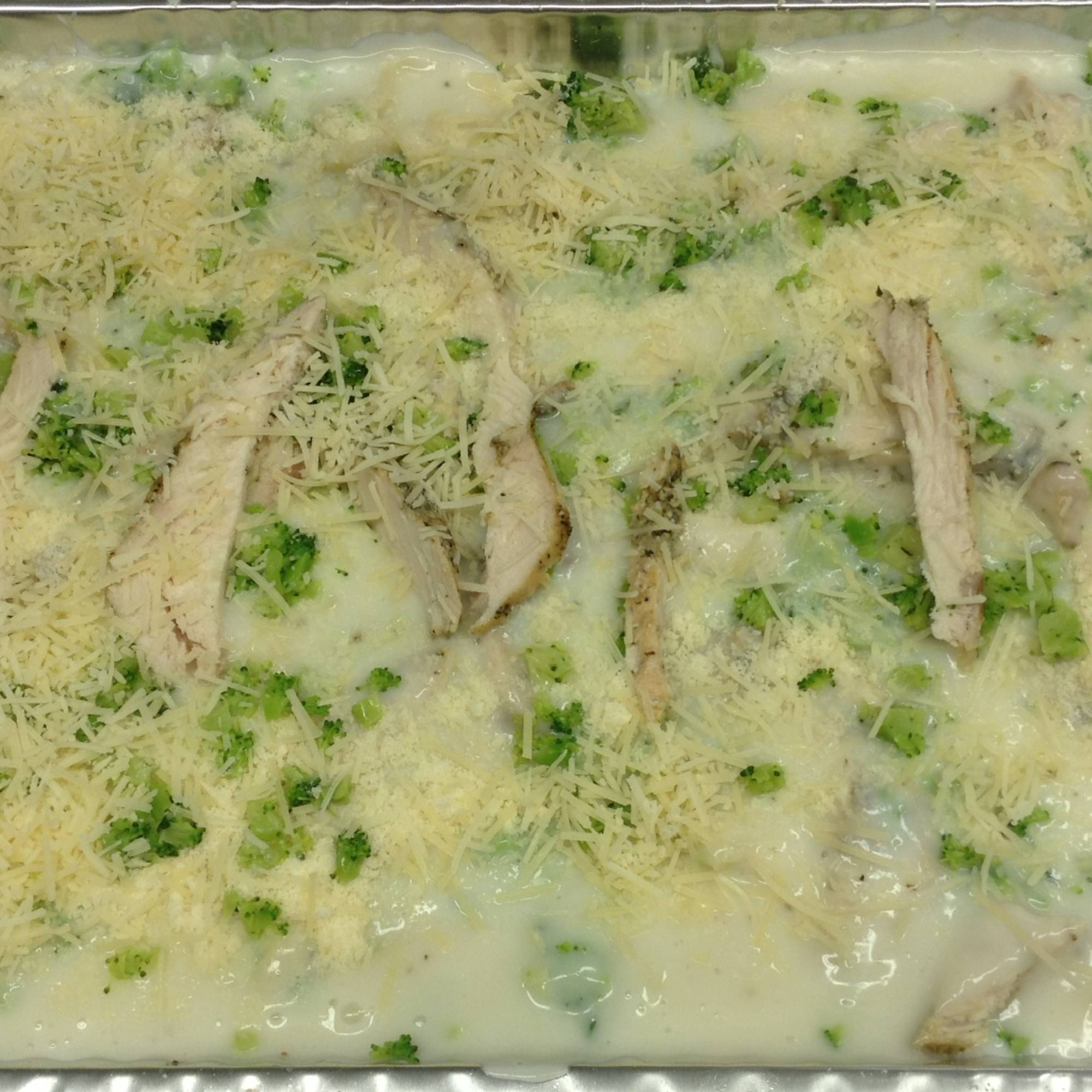 A close up of broccoli and cheese casserole
