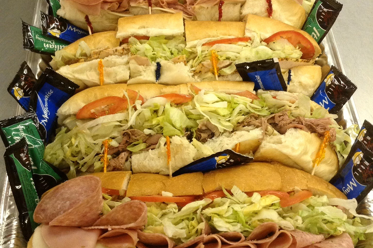 image 22 A large sandwich platter with many different sandwiches.