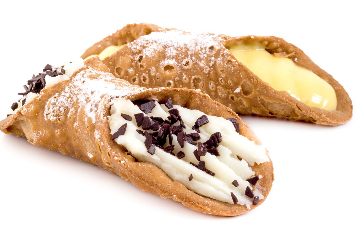 Two pastries are shown with icing and chocolate.