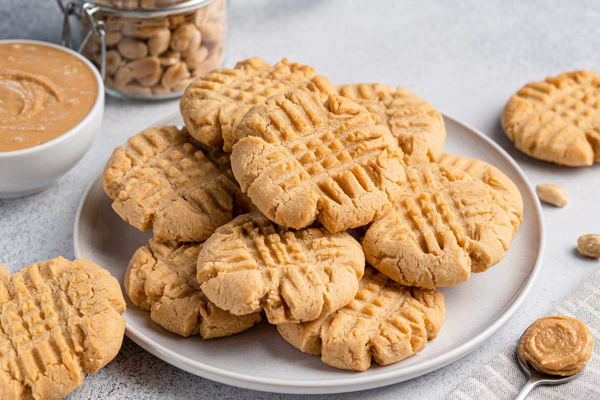 A plate of peanut butter cookies on top of a table.